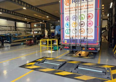 A&M Commercials HGV workshop transformation with custom demarcation lines and epoxy resin flooring.