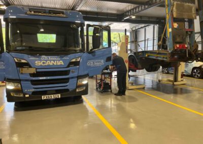 A&M Commercials HGV workshop transformation with custom demarcation lines and epoxy resin flooring.