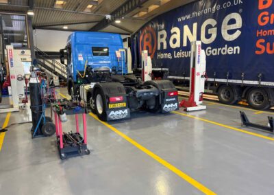 A&M Commercials HGV workshop transformation with custom demarcation lines and epoxy resin flooring.